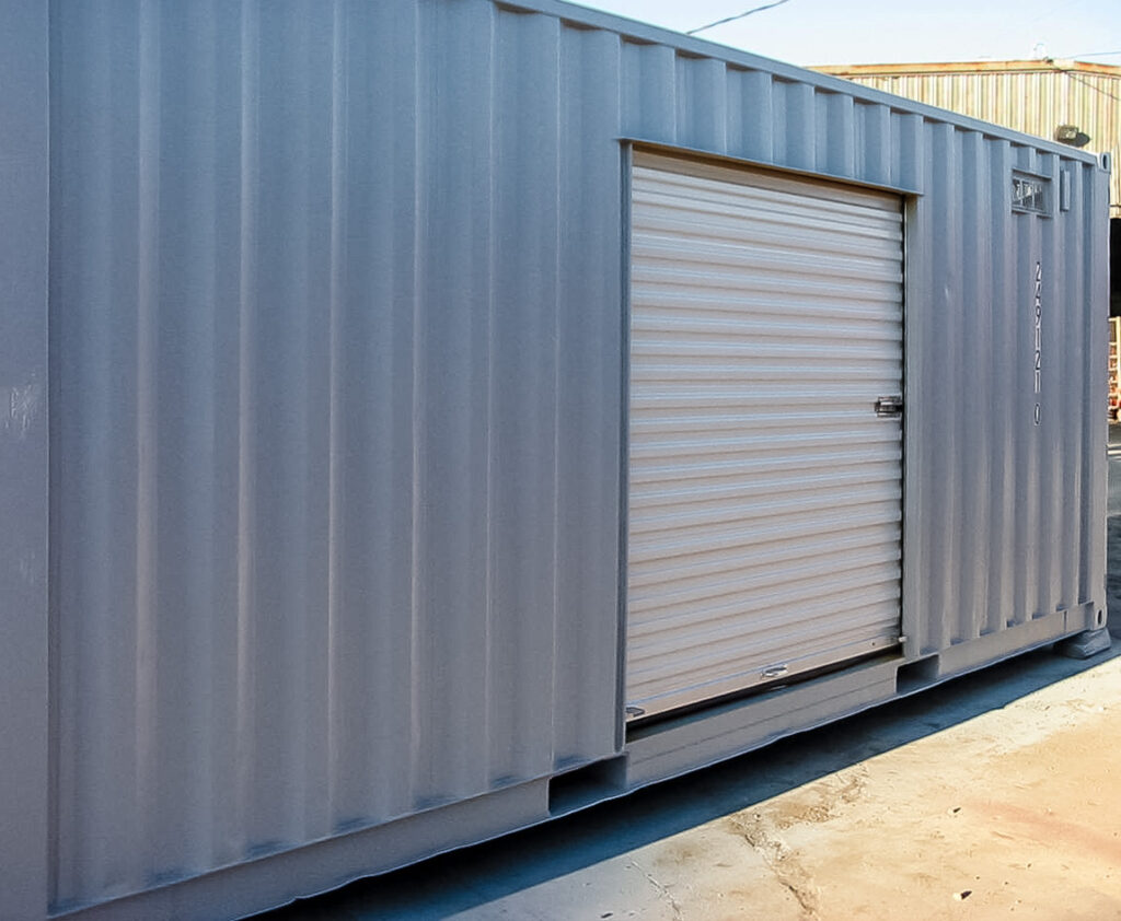 Modified shipping container with a roll-up side door