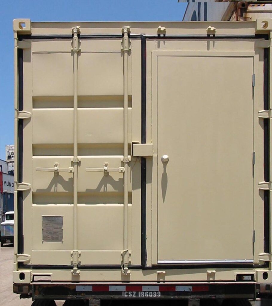 Modified shipping container with a personal door installed