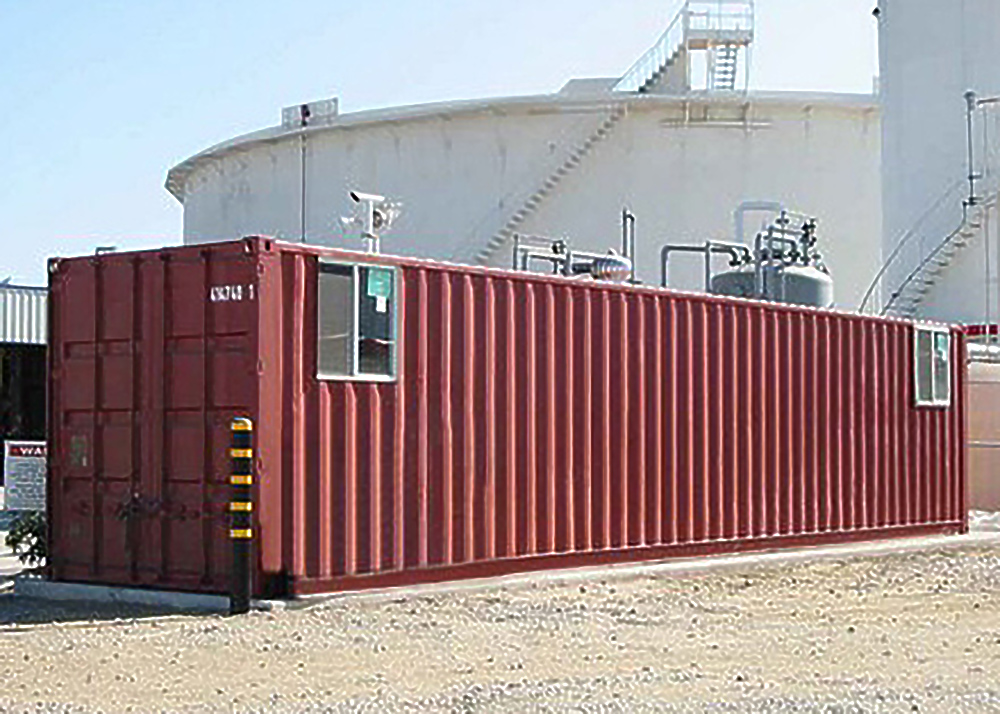 Modified shipping container with sliding windows installed